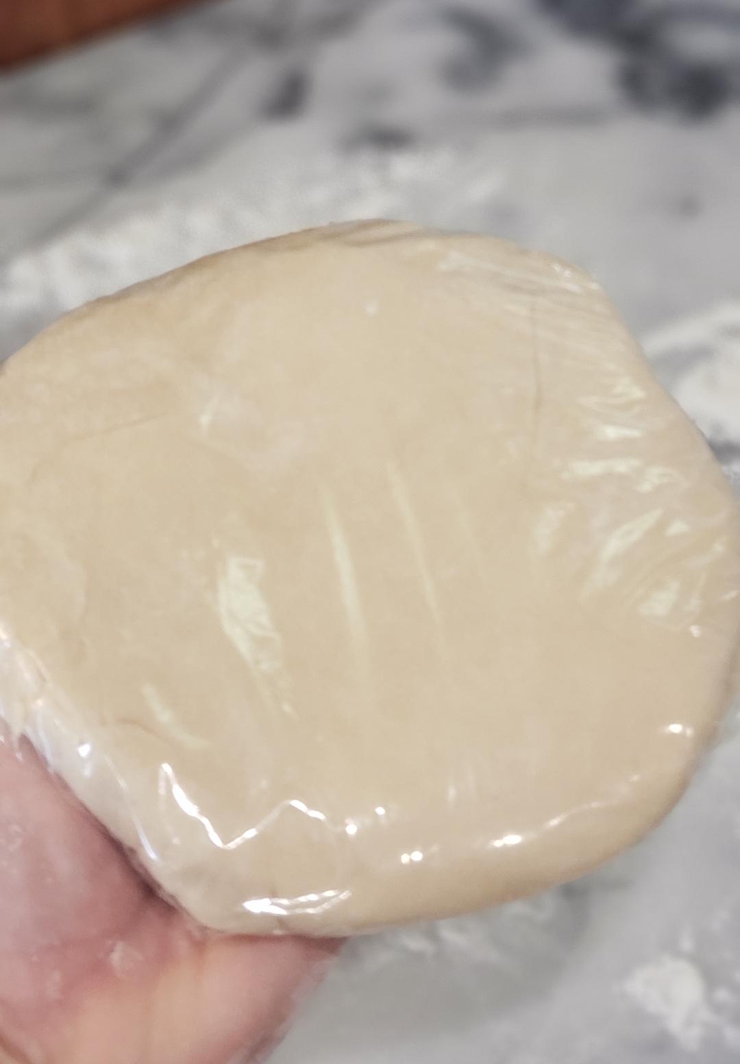 tart crust in plastic wrap